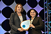 Amber Mahrou accepts Licensed Certification Provider Partner of the Year for Energy Inspectors Corporation.